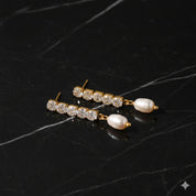 Boucles d’oreilles pendantes zirconium avec perle