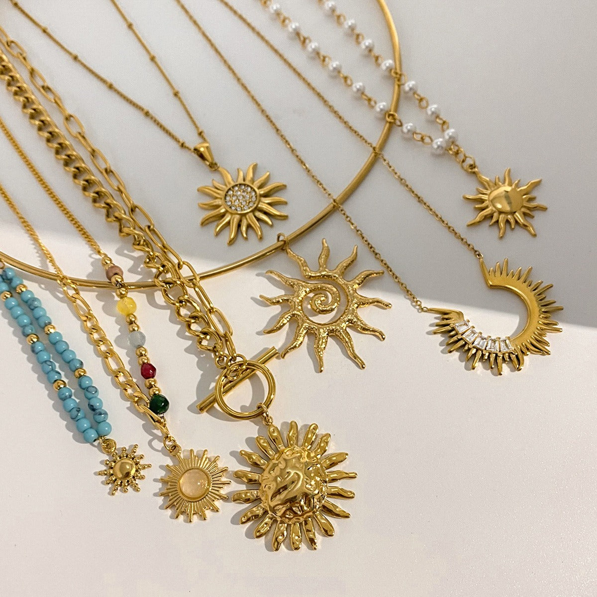 Collier pendentif soleil femme – acier inoxydable et or 18K