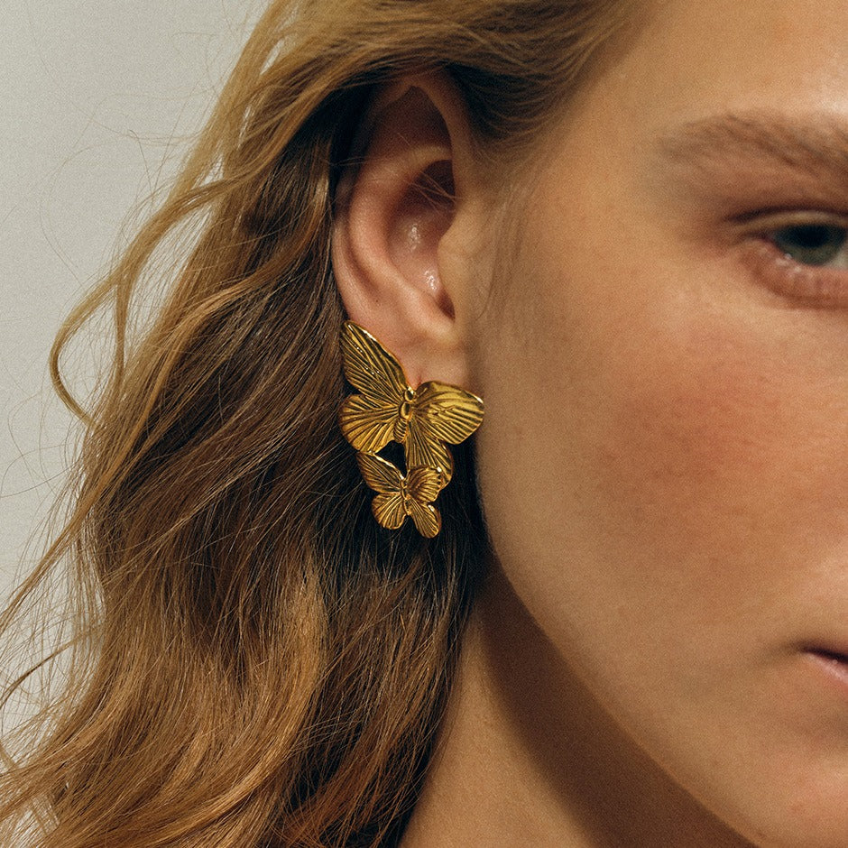 Boucles d’oreilles papillon dorées en acier inoxydable