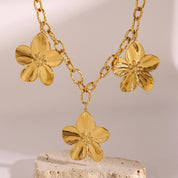 Collier fleur en acier inoxydable et or 18 K PVL