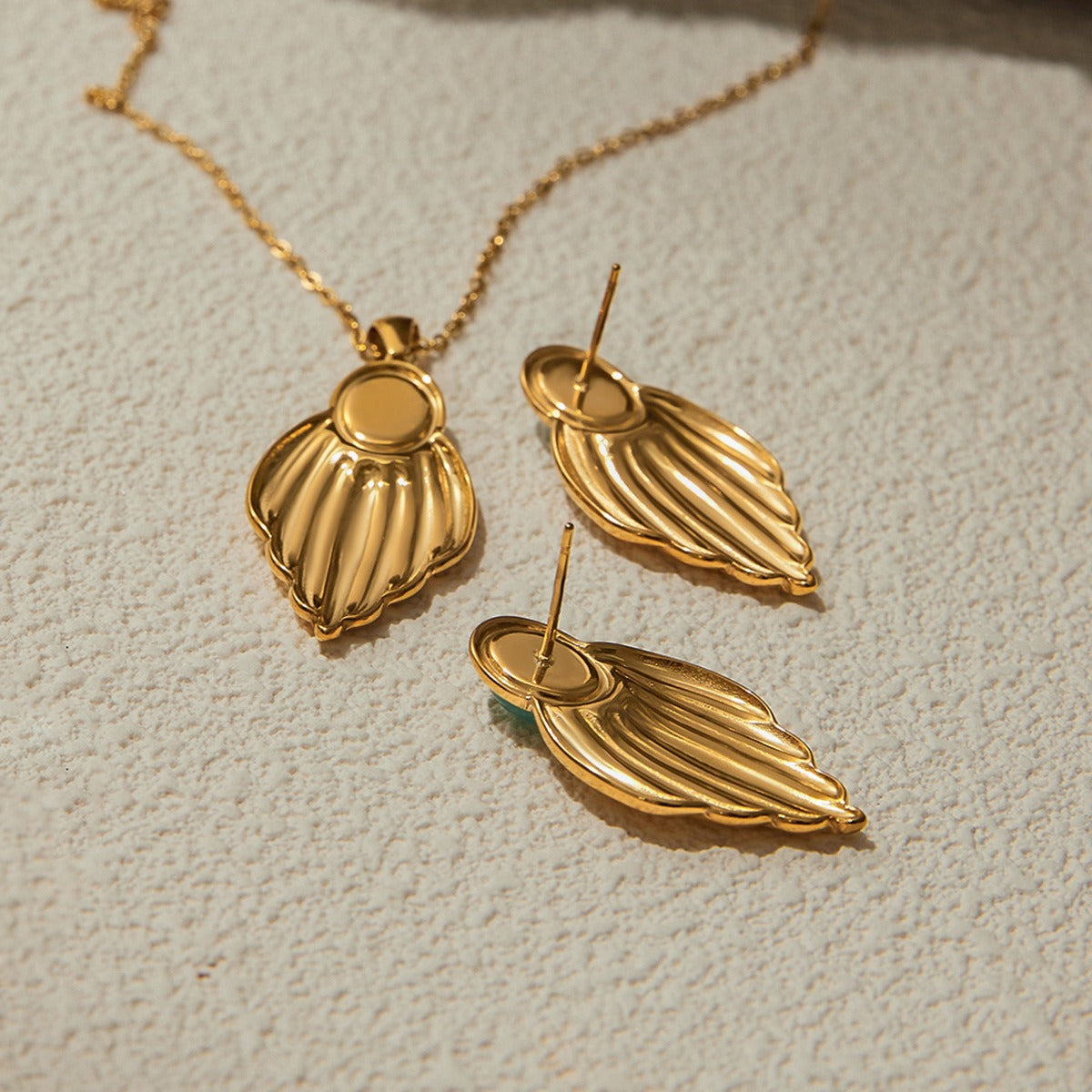 Parure feuilles dorées femme avec pierres en acier inoxydable et PVD 18K