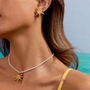 Parure soleil visage dorée femme en acier inoxydable et PVD 18K